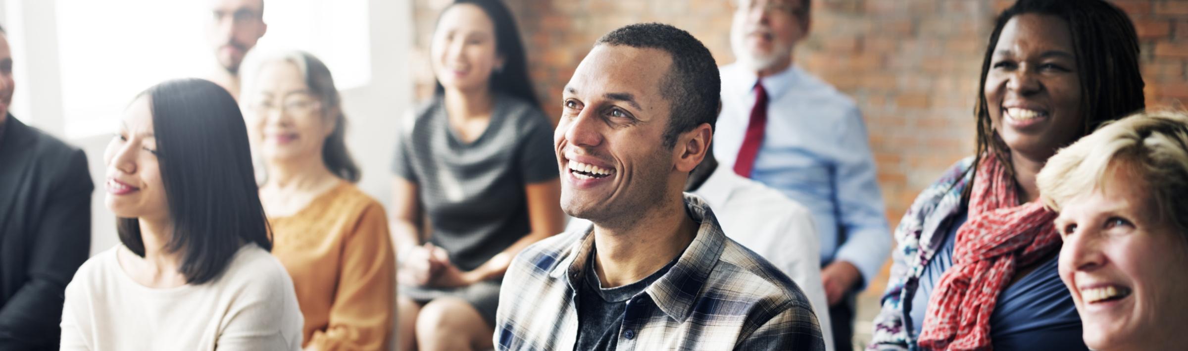 Menschengruppe sitzend - Lernsituation